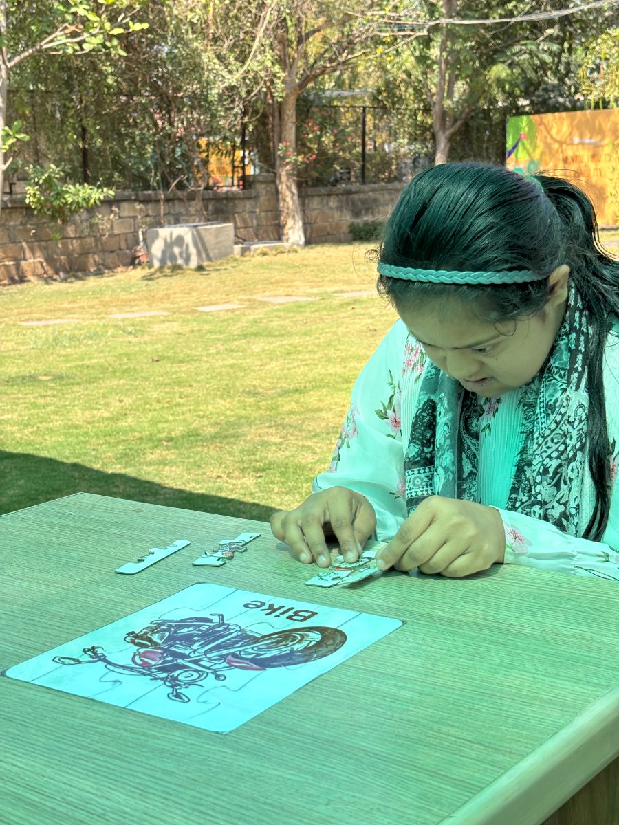 A beneficiary completing a picture puzzle during an assessment session